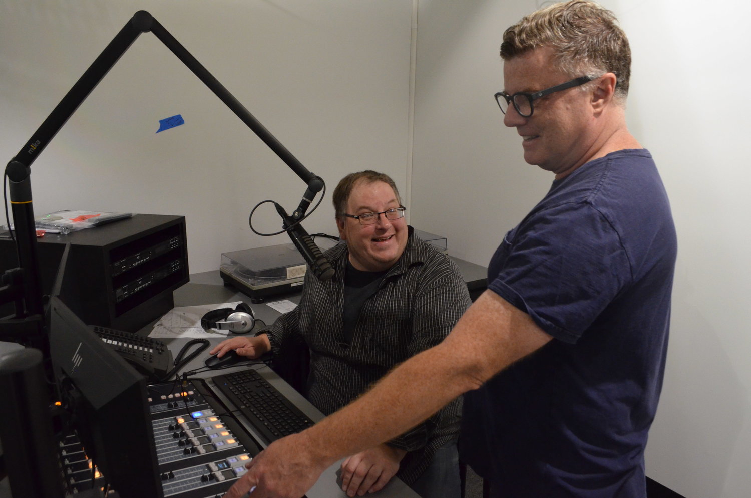 Radio Catskill general manager Tim Bruno and program director Jason Dole at the new station's soundboard.